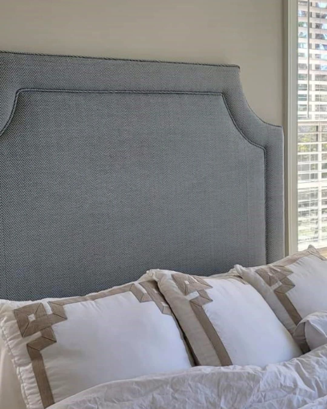 Custom upholstered headboard in herringbone fabric
